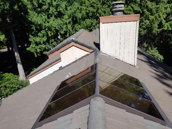 Photo taken from the top of a new shingle roof.
